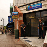 Security guards guard a bank along Calle Obregon in Nogales, Sonora, Mexico, across the border from Nogales, Arizona, USA.
